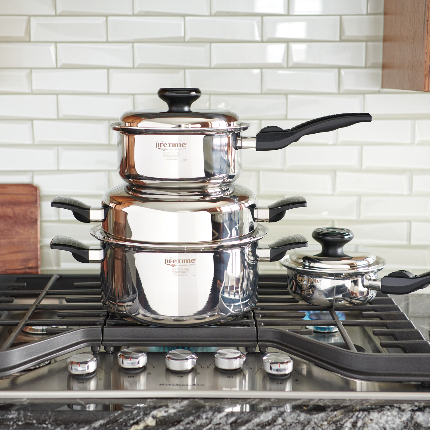 Three Lifetime Cookware Pots Stacked on a Stovetop