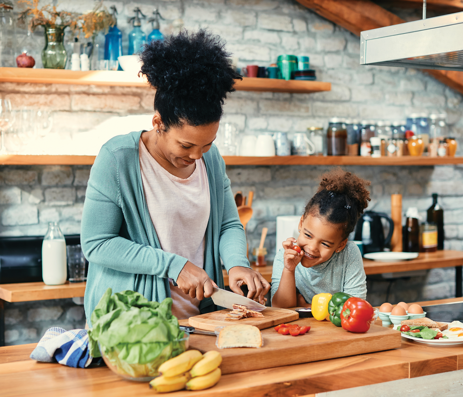 A Mother Chopping Ingredients With Her Daughter