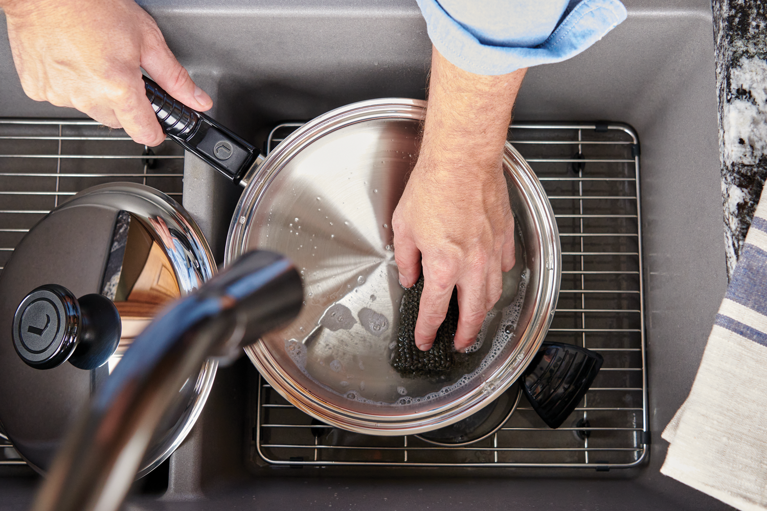 A Lifetime Cookware Pot Being Washed in the Sink